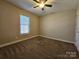 Bedroom featuring carpet floors, a ceiling fan, and a window at 159 S Gibbs Rd, Mooresville, NC 28117