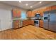 Spacious kitchen with stainless steel appliances, wooden cabinets, and granite countertops at 159 S Gibbs Rd, Mooresville, NC 28117