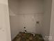 Laundry room with white walls, vinyl flooring, and wire shelving storage at 159 S Gibbs Rd, Mooresville, NC 28117
