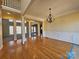 Bright and airy living room with hardwood floors, chandelier, and views to other living spaces at 159 S Gibbs Rd, Mooresville, NC 28117