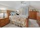 Bright bedroom featuring natural light, floral bedding, and a matching wooden dresser at 1918 Ealand Ct, Waxhaw, NC 28173