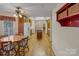 Cozy dining area features oak cabinets and a view into the living area at 201 Olive Rd, Stony Point, NC 28678