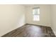 Bright bedroom with hardwood floors, one window, and ample natural light at 20115 Henderson Rd # D, Cornelius, NC 28031