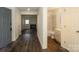 Inviting foyer featuring wood-look flooring and an adjacent powder room at 20115 Henderson Rd # D, Cornelius, NC 28031