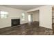 Bright living room features a fireplace and sliding glass doors to a deck at 20115 Henderson Rd # D, Cornelius, NC 28031