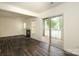 Bright living room with sliding glass doors to a deck and corner fireplace at 20115 Henderson Rd # D, Cornelius, NC 28031
