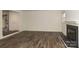 Spacious living room features a fireplace and modern wood-look flooring at 20115 Henderson Rd # D, Cornelius, NC 28031
