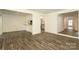 Large living room with breakfast bar, and sliding glass doors to outdoor patio at 20115 Henderson Rd # D, Cornelius, NC 28031