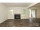 Open living room with cozy fireplace and sliding doors to outdoor space at 20115 Henderson Rd # D, Cornelius, NC 28031