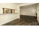 Open living room features a breakfast bar and view of fireplace in den at 20115 Henderson Rd # D, Cornelius, NC 28031