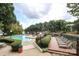 Inviting community pool with lounge chairs and waterfront access at 20115 Henderson Rd # D, Cornelius, NC 28031