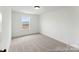 Bedroom with neutral carpet and a window at 205 Tillery Ln # 759, Mount Gilead, NC 27306