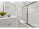 Well-lit bathroom featuring modern vanity, sleek fixtures, and a glass-enclosed shower for a luxurious experience at 209 Tillery Ln # 758, Mount Gilead, NC 27306