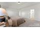 Comfortable main bedroom with soft carpeting, neutral tones, and convenient access to en-suite bathroom and walk-in closet at 209 Tillery Ln # 758, Mount Gilead, NC 27306