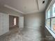 Unfinished bedroom featuring french doors, tray ceiling, and large windows in a new construction home at 2210 Camber Dr # Cwo0075, Gastonia, NC 28054