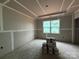 Bedroom with a large window and drywall ready for paint at 2210 Camber Dr # Cwo0075, Gastonia, NC 28054