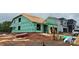Exterior view of a new house under construction with green siding and an unfinished roof in a residential neighborhood at 2210 Camber Dr # Cwo0075, Gastonia, NC 28054