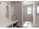 Inviting entryway with a built-in bench, coat hooks, and a neutral color palette leading into a tiled foyer at 2210 Camber Dr # Cwo0075, Gastonia, NC 28054