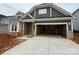 Charming new construction home with stone accents, gray siding, and a spacious two-car garage at 2210 Camber Dr # Cwo0075, Gastonia, NC 28054