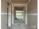 Unfinished home interior shows doorway to living space. 