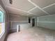 Unfinished open concept living room with taped drywall and a large window at 2210 Camber Dr # Cwo0075, Gastonia, NC 28054