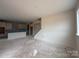 Large living room area with open access to the kitchen, ready to be customized at 2210 Camber Dr # Cwo0075, Gastonia, NC 28054