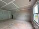 Unfinished living room with taped drywall, a window, and doorway at 2210 Camber Dr # Cwo0075, Gastonia, NC 28054