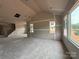 Spacious living room area is under construction with bare walls and floors, and large windows at 2210 Camber Dr # Cwo0075, Gastonia, NC 28054