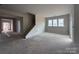 Spacious living room with large windows, ready for personalization and comfortable living at 2210 Camber Dr # Cwo0075, Gastonia, NC 28054