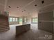 Spacious living room area is under construction with bare walls and floors at 2210 Camber Dr # Cwo0075, Gastonia, NC 28054