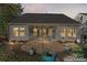 Home exterior highlighting the screened porch and stone patio in the expansive, private backyard at 2439 Bergamot St, Fort Mill, SC 29708