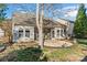 Backyard featuring a screened porch, patio, privacy fence, and lush landscaping at 2439 Bergamot St, Fort Mill, SC 29708