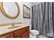 Stylish bathroom with a vanity, decorative mirror, framed art, and a shower with an elegant curtain at 2439 Bergamot St, Fort Mill, SC 29708