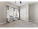 Comfortable bedroom featuring two windows, plush carpeting, and a spacious closet at 2439 Bergamot St, Fort Mill, SC 29708
