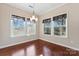 Bright dining room featuring a modern chandelier and large windows at 2439 Bergamot St, Fort Mill, SC 29708