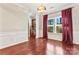 Charming dining room featuring hardwood floors, a chandelier, and natural light from large windows at 2439 Bergamot St, Fort Mill, SC 29708
