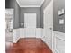 Spacious foyer featuring hardwood floors and elegant white wainscoting at 2439 Bergamot St, Fort Mill, SC 29708