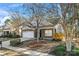 Charming brick home featuring a well-manicured lawn and an attached two-car garage at 2439 Bergamot St, Fort Mill, SC 29708