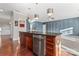 Well-appointed kitchen island with wood cabinets, stainless steel appliances, and modern pendant lighting at 2439 Bergamot St, Fort Mill, SC 29708