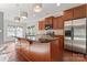 Modern kitchen featuring a large island, stainless steel appliances, and elegant pendant lighting at 2439 Bergamot St, Fort Mill, SC 29708