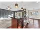 Spacious kitchen island with dark countertops, wood cabinetry, and stylish pendant lighting at 2439 Bergamot St, Fort Mill, SC 29708