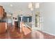 Open-concept kitchen boasts an island, pendant lighting, and hardwood floors at 2439 Bergamot St, Fort Mill, SC 29708