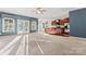 Large living room featuring natural light, plush carpet and an open-concept layout at 2439 Bergamot St, Fort Mill, SC 29708