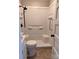 Clean bathroom featuring a tub, shower, neutral tile, and modern fixtures, ready for a refreshing experience at 2507 Florida Ave, Kannapolis, NC 28083