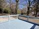 A spacious gray painted deck with wood railing offers an outdoor space at 2507 Florida Ave, Kannapolis, NC 28083