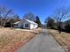 Quaint one-story home with a long driveway and a detached garage, perfect for storage or a workshop at 2507 Florida Ave, Kannapolis, NC 28083