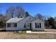 Charming one-story home with white siding and a well-maintained front yard under a clear blue sky at 2507 Florida Ave, Kannapolis, NC 28083