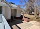 Rear exterior view of the home with gray painted deck, patio and yard at 2507 Florida Ave, Kannapolis, NC 28083