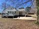 Exterior view of home featuring a gray painted deck and spacious backyard at 2507 Florida Ave, Kannapolis, NC 28083