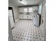 Bright kitchen with white cabinets, black hardware, and contrasting black and white flooring at 2507 Florida Ave, Kannapolis, NC 28083
